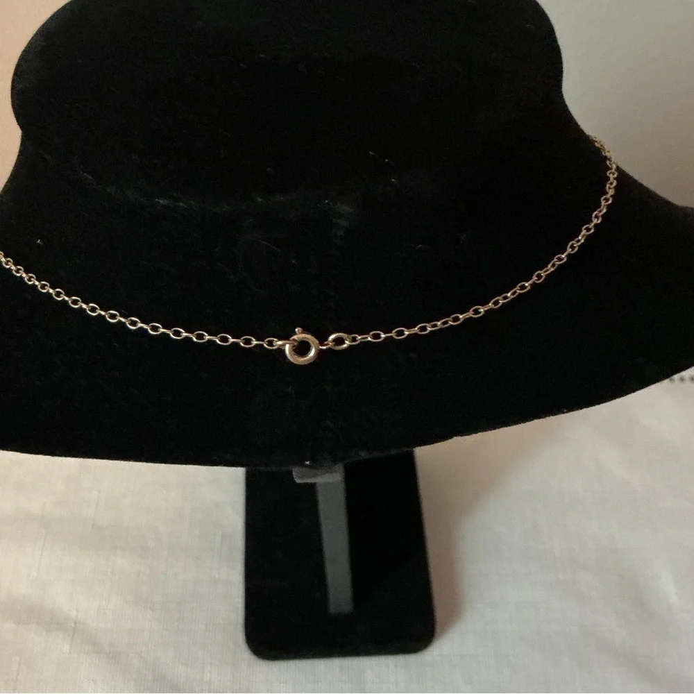 Black Oval Gold Tone Pendant Necklace